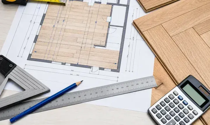 Dimensionnement parquet avec plan de pièce, cotes, règle et calcul des surfaces